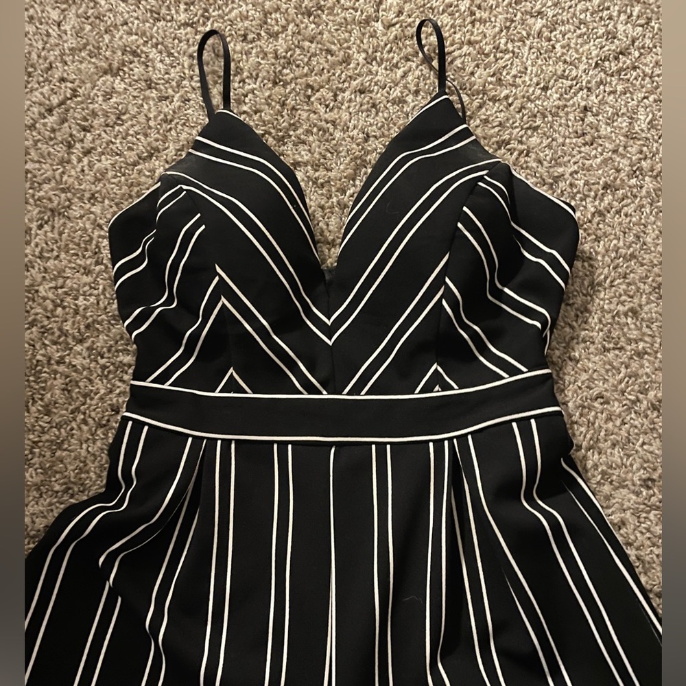 Dillards, brand honey and Rosie V printed black jumpsuit